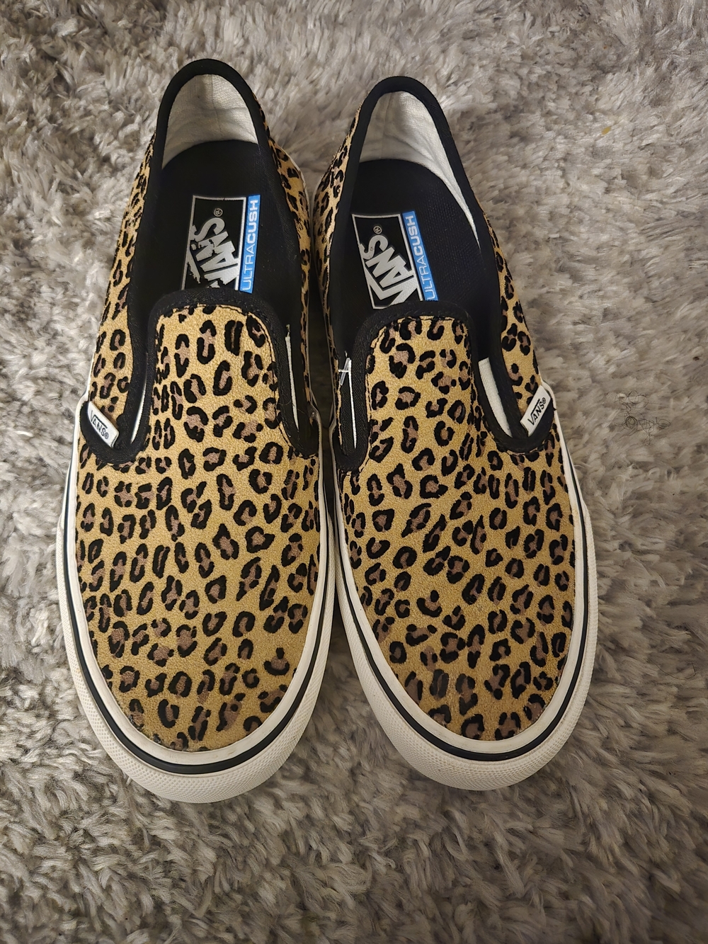 Vans Leopard Print Slip-On Sneakers in Black and Tan